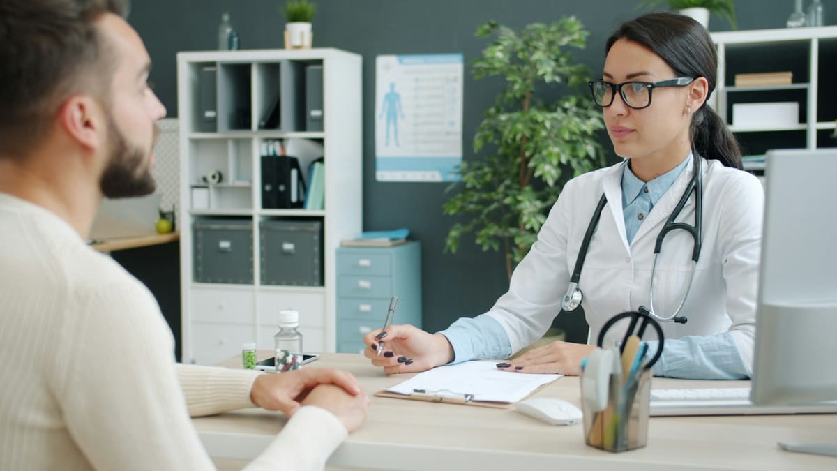A physician in consultation with a patient