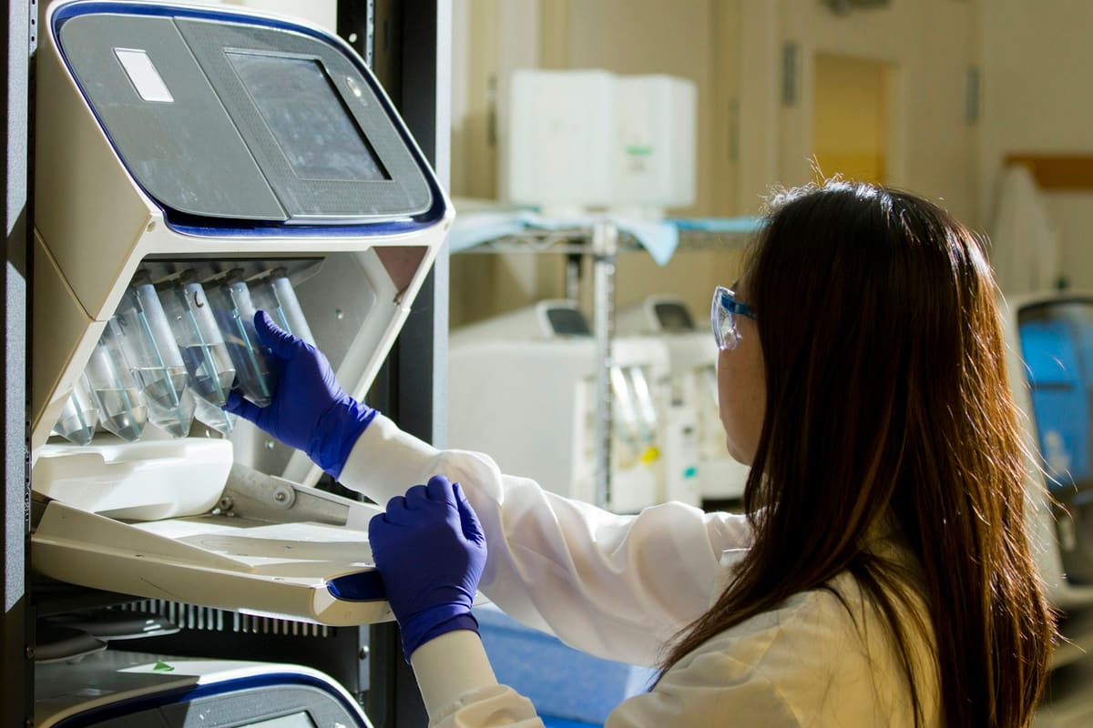 A laboratory technician preparing samples for analysis
